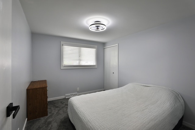 327 Warlock Ct, Columbus, OH 43230 - bedroom with dark carpet, baseboards, and a closet