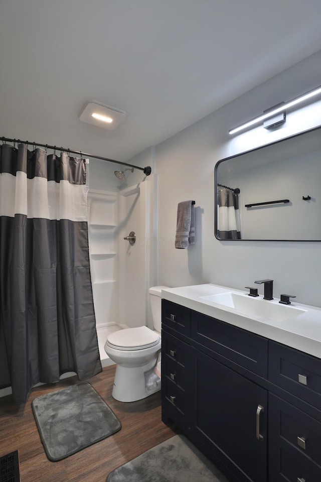 327 Warlock Ct, Columbus, OH 43230 - bathroom featuring wood finished floors, toilet, a shower with curtain, and vanity