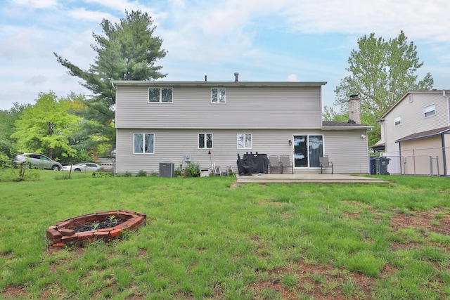 327 Warlock Ct, Columbus, OH 43230 - rear view of house with a fire pit, cooling unit, and a chimney