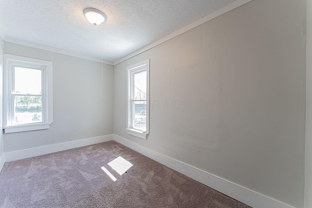 167 Essex St, Newark, OH 43055 - carpeted spare room with plenty of natural light, a textured ceiling, baseboards, and crown molding