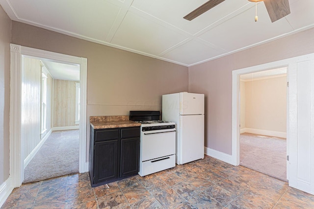 167 Essex St, Newark, OH 43055 - kitchen featuring white appliances, carpet flooring, dark cabinets, a ceiling fan, and baseboards