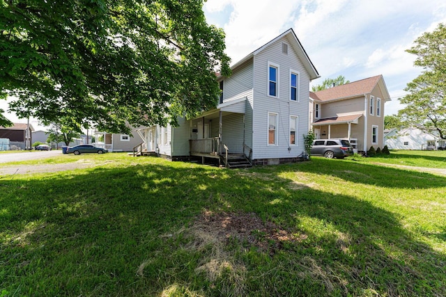167 Essex St, Newark, OH 43055 - view of side of property with a yard and covered porch