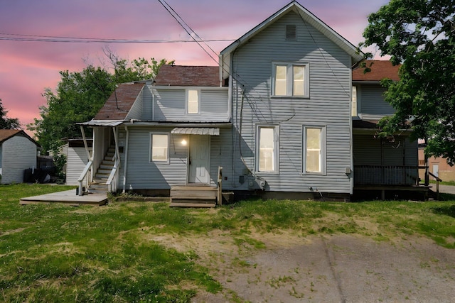 167 Essex St, Newark, OH 43055 - rear view of house featuring a lawn