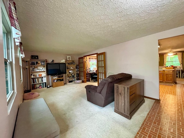 346 Instone Dr, Reynoldsburg, OH 43068 - living area with brick patterned flooring, baseboards, and a textured ceiling