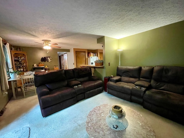 346 Instone Dr, Reynoldsburg, OH 43068 - carpeted living area featuring a ceiling fan and a textured ceiling