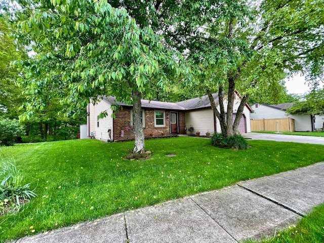 346 Instone Dr, Reynoldsburg, OH 43068 - single story home with concrete driveway, brick siding, a front lawn, and a garage
