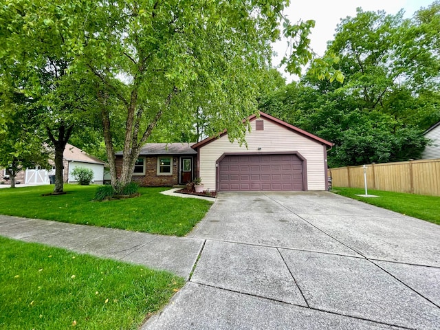 346 Instone Dr, Reynoldsburg, OH 43068 - ranch-style house featuring brick siding, an attached garage, and driveway