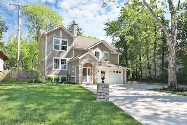 258 Canyon Dr, Columbus, OH 43214 - view of front of home with driveway, a chimney, a garage, and stone siding
