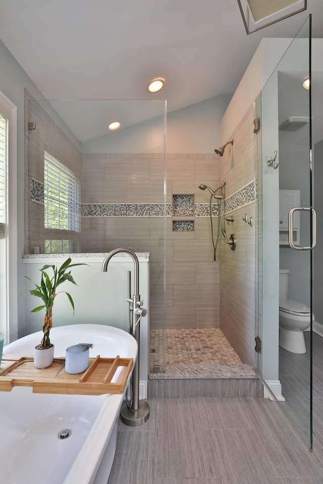 258 Canyon Dr, Columbus, OH 43214 - full bathroom featuring a stall shower, a freestanding tub, recessed lighting, toilet, and wood finished floors