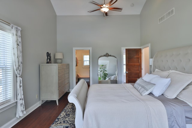 258 Canyon Dr, Columbus, OH 43214 - bedroom with high vaulted ceiling, dark wood-style floors, baseboards, ceiling fan, and connected bathroom