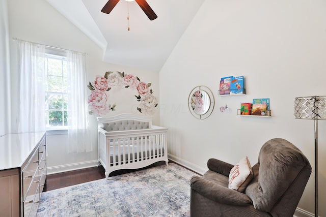 258 Canyon Dr, Columbus, OH 43214 - bedroom with lofted ceiling, a crib, dark wood finished floors, baseboards, and a ceiling fan