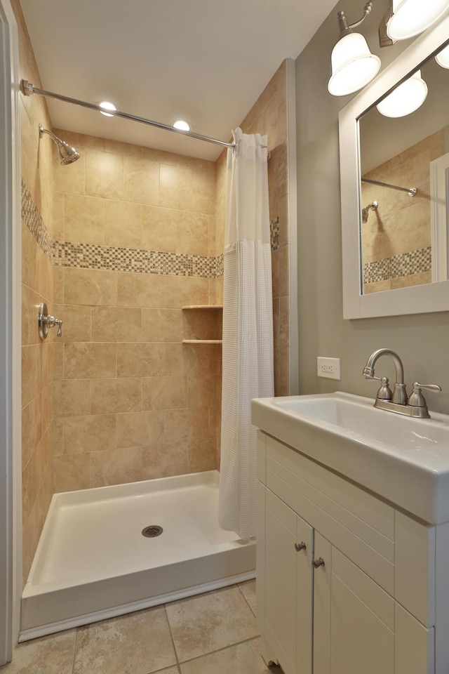 258 Canyon Dr, Columbus, OH 43214 - full bath featuring tile patterned flooring, a stall shower, and vanity