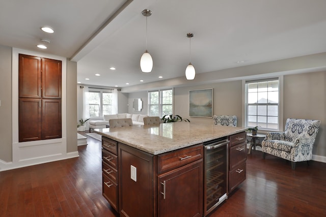 258 Canyon Dr, Columbus, OH 43214 - kitchen with wine cooler, dark wood finished floors, recessed lighting, pendant lighting, and light stone counters