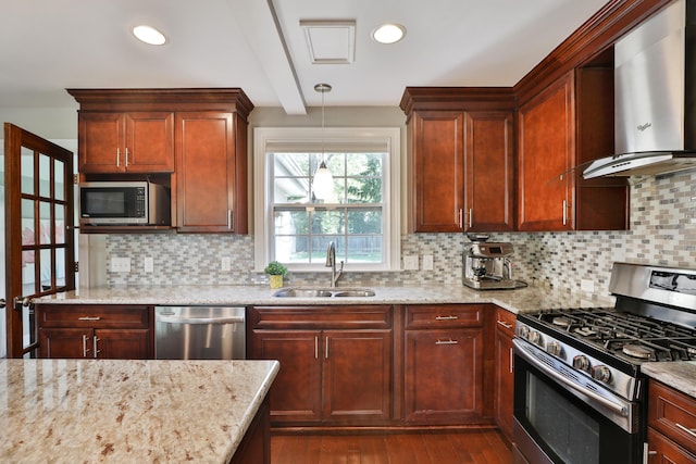 258 Canyon Dr, Columbus, OH 43214 - kitchen featuring appliances with stainless steel finishes, a sink, wall chimney range hood, light stone counters, and dark wood-type flooring