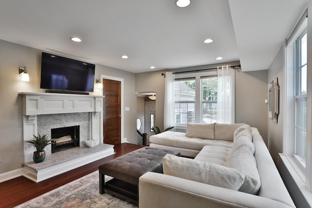 258 Canyon Dr, Columbus, OH 43214 - living room with a premium fireplace, dark wood-style flooring, recessed lighting, and baseboards
