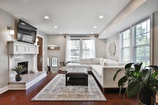 258 Canyon Dr, Columbus, OH 43214 - living area with recessed lighting, plenty of natural light, dark wood-style floors, a high end fireplace, and baseboards
