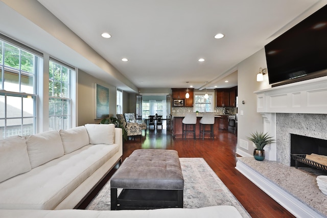 258 Canyon Dr, Columbus, OH 43214 - living room with recessed lighting, dark wood finished floors, and a fireplace
