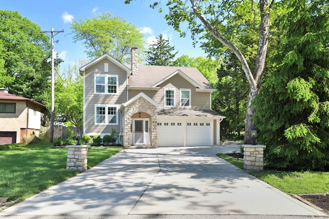 258 Canyon Dr, Columbus, OH 43214 - traditional home featuring driveway, stone siding, a garage, a front yard, and a chimney