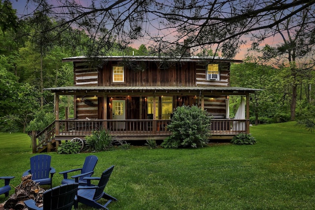 23587 Woltz Rd, Rockbridge, OH 43149 - view of front of home featuring a front lawn, a wooden deck, and cooling unit