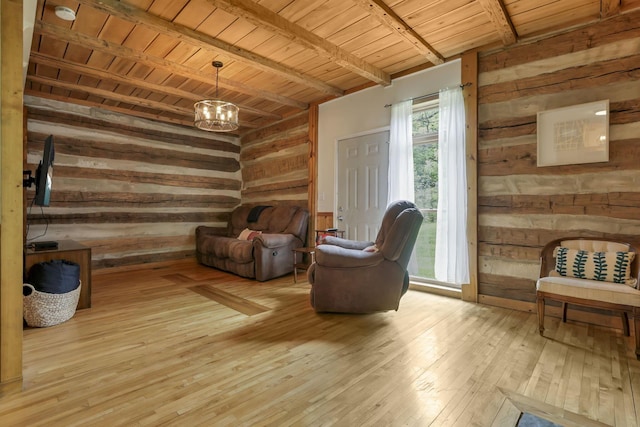 23587 Woltz Rd, Rockbridge, OH 43149 - living area featuring wooden walls, wooden ceiling with exposed beams, wood-type flooring, and a chandelier