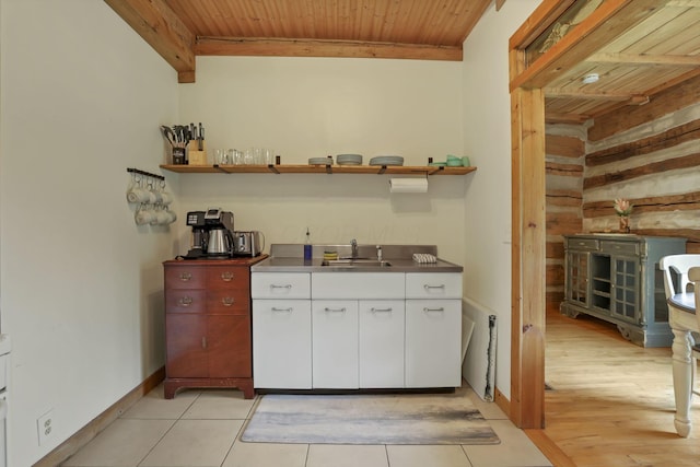 23587 Woltz Rd, Rockbridge, OH 43149 - indoor bar with wood ceiling, baseboards, light tile patterned floors, and wood walls