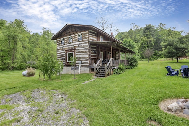 23587 Woltz Rd, Rockbridge, OH 43149 - exterior space featuring a lawn, log exterior, and a wooden deck