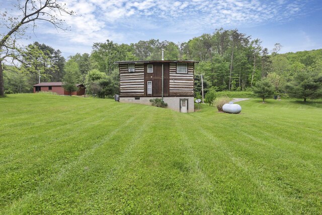 23587 Woltz Rd, Rockbridge, OH 43149 - view of grassy yard featuring a forest view