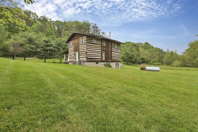 23587 Woltz Rd, Rockbridge, OH 43149 - view of grassy yard featuring cooling unit