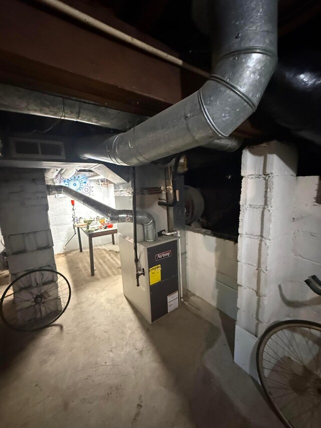 1482 Briarwood Ave, Columbus, OH 43211 - unfinished below grade area featuring concrete block wall and heating unit