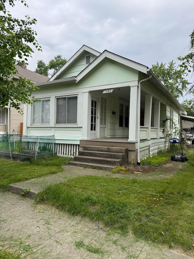 1482 Briarwood Ave, Columbus, OH 43211 - view of front of property with a porch and a front yard