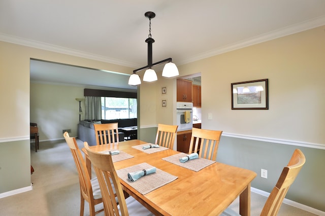 6653 Merwin Rd, Columbus, OH 43235 - dining area with crown molding, baseboards, and light carpet