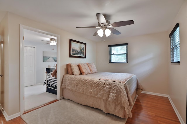 6653 Merwin Rd, Columbus, OH 43235 - bedroom with baseboards, wood finished floors, and a ceiling fan
