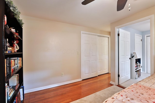 6653 Merwin Rd, Columbus, OH 43235 - bedroom with wood finished floors, baseboards, and ceiling fan