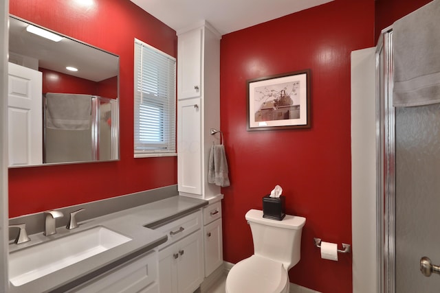 6653 Merwin Rd, Columbus, OH 43235 - full bathroom with vanity, a shower with shower door, and toilet
