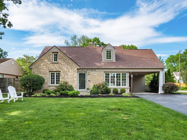 2356 Swansea Rd, Columbus, OH 43221 - view of front of property with stone siding, driveway, a chimney, roof with shingles, and an attached carport