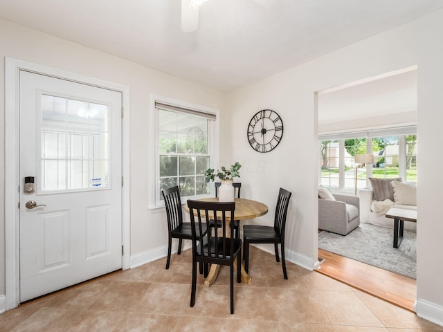 2356 Swansea Rd, Columbus, OH 43221 - dining area with baseboards, light tile patterned floors, and a ceiling fan