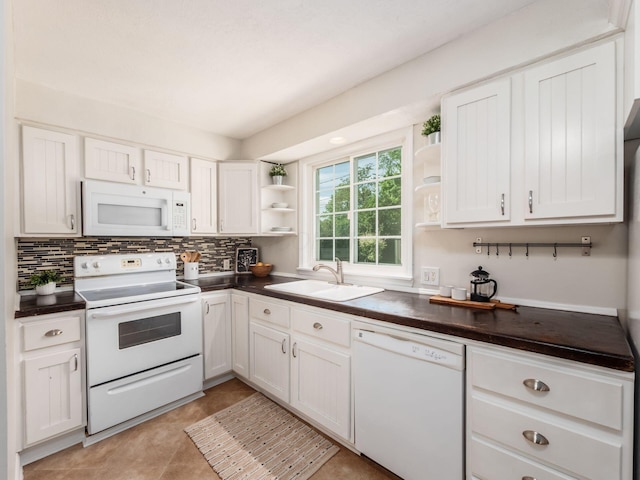 2356 Swansea Rd, Columbus, OH 43221 - kitchen featuring white appliances, open shelves, dark countertops, a sink, and decorative backsplash