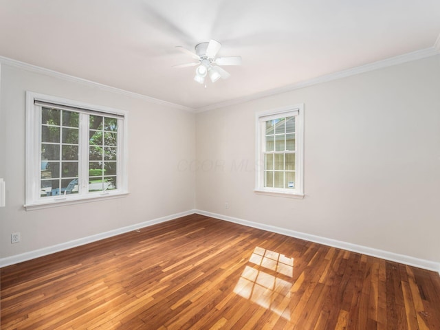2356 Swansea Rd, Columbus, OH 43221 - empty room featuring crown molding, healthy amount of natural light, baseboards, and wood-type flooring