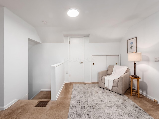 2356 Swansea Rd, Columbus, OH 43221 - living area featuring carpet, baseboards, lofted ceiling, and an upstairs landing