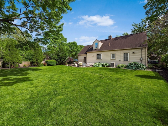 2356 Swansea Rd, Columbus, OH 43221 - rear view of house featuring a chimney, cooling unit, and a patio