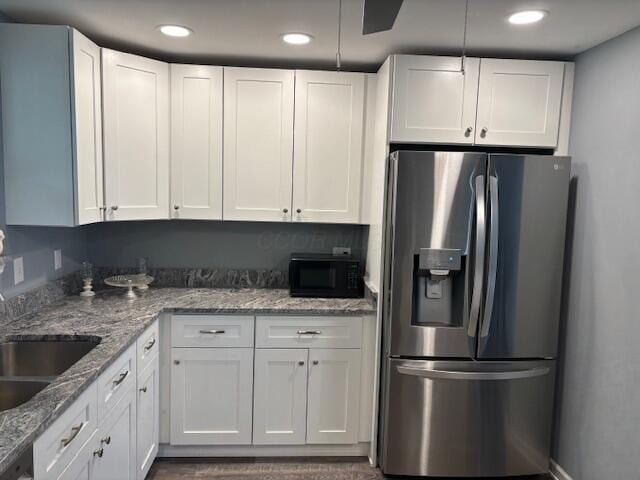 4367 Helena Ct, Springfield, OH 45503 - kitchen with stainless steel fridge, black microwave, a sink, white cabinets, and recessed lighting