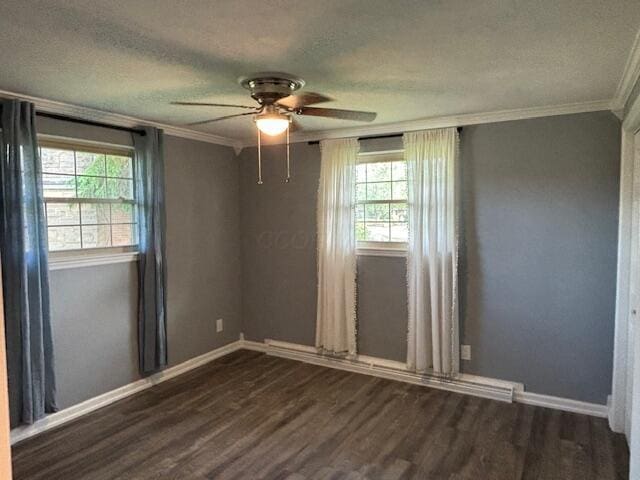 4367 Helena Ct, Springfield, OH 45503 - spare room featuring plenty of natural light, ornamental molding, ceiling fan, dark wood finished floors, and a textured ceiling