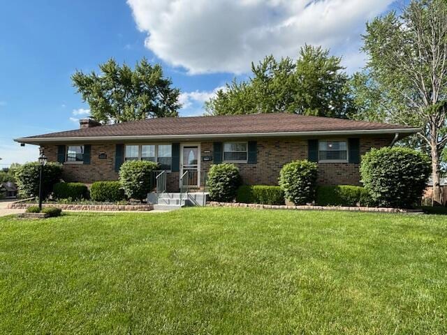4367 Helena Ct, Springfield, OH 45503 - ranch-style house featuring brick siding, a front lawn, and a chimney
