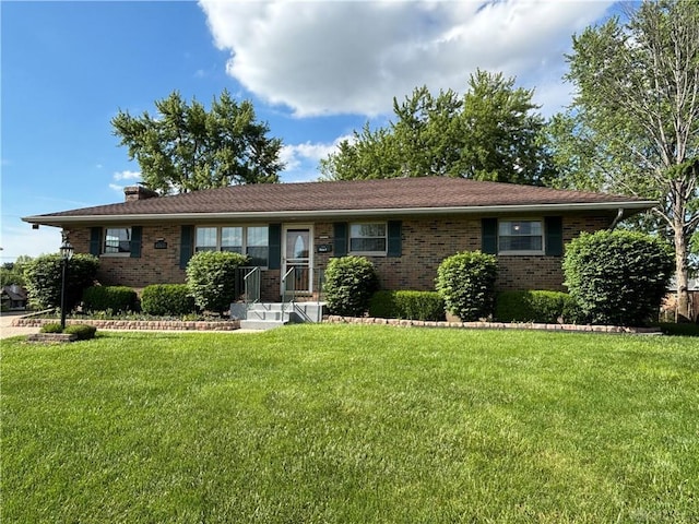 4367 Helena Ct, Springfield, OH 45503 - ranch-style house with brick siding, a front yard, and a chimney