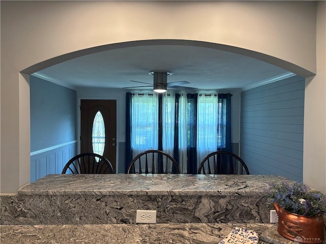4367 Helena Ct, Springfield, OH 45503 - dining room with arched walkways, ornamental molding, ceiling fan, and wainscoting