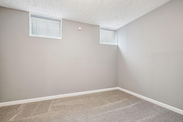 1536 Mulligan Ct, Reynoldsburg, OH 43068 - basement with a textured ceiling, carpet floors, and baseboards