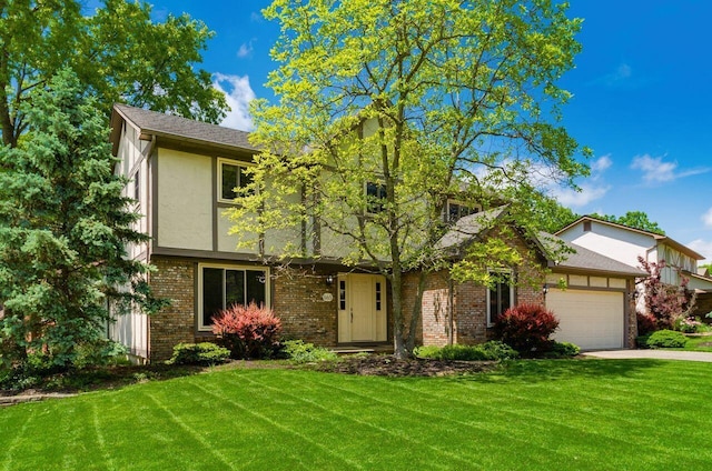 665 Northbridge Ct, Westerville, OH 43081 - view of front of property with a garage, a front lawn, brick siding, and driveway