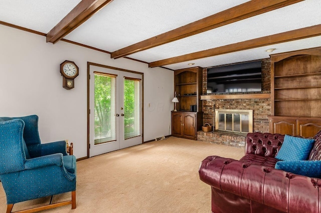 665 Northbridge Ct, Westerville, OH 43081 - carpeted living room featuring beam ceiling, a textured ceiling, a brick fireplace, french doors, and built in features