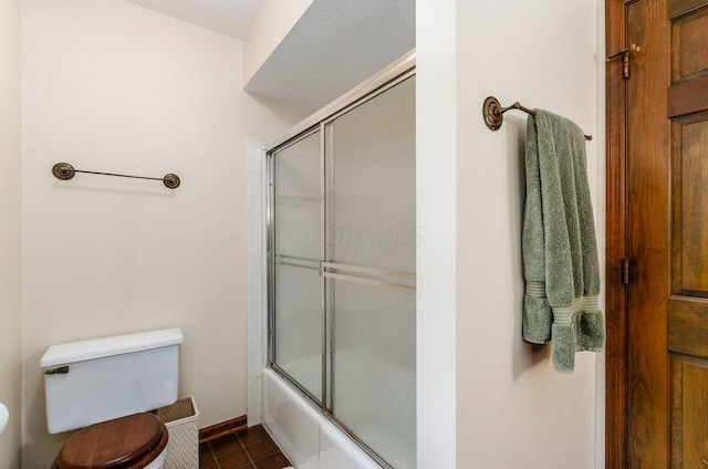 665 Northbridge Ct, Westerville, OH 43081 - bathroom with toilet, bath / shower combo with glass door, and tile patterned floors