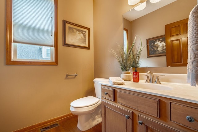 8738 Birch Brook Loop NW, Pickerington, OH 43147 - half bath featuring vanity, toilet, wood finished floors, and baseboards
